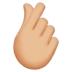 🫰🏼 hand with index finger and thumb crossed: medium-light skin tone display on Apple